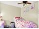 Bedroom with hardwood floors and charming decorations on the wall at 6837 Doris Dr, Indianapolis, IN 46214