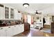 Eat-in kitchen features bright cabinets, hardwood floors, and a breakfast nook at 6837 Doris Dr, Indianapolis, IN 46214