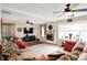 Bright living room features a fireplace, ceiling fan, and comfortable seating at 6837 Doris Dr, Indianapolis, IN 46214