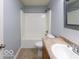 Bathroom featuring tub and shower combo, tile flooring, and vanity with sink at 7108 Burlat Ln, Noblesville, IN 46062