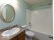 Cozy bathroom with shower and tub combo, and a vanity with new fixtures at 7108 Burlat Ln, Noblesville, IN 46062