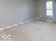 Bedroom with neutral carpet, fresh paint, and a window with views of the outdoors at 7108 Burlat Ln, Noblesville, IN 46062