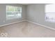 Bright bedroom with neutral carpet, great natural light, and base molding at 7108 Burlat Ln, Noblesville, IN 46062