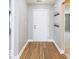 Bright entryway showcases elegant wood floors and a coat rack for added functionality at 7108 Burlat Ln, Noblesville, IN 46062