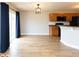 Stylish room features wood floors, modern lighting, and sliding glass doors to the outdoors at 7108 Burlat Ln, Noblesville, IN 46062