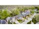 Aerial view of a neighborhood showcasing beautiful homes, mature trees, and landscaping at 7653 Carriage House Way, Zionsville, IN 46077