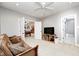 Basement living area with a comfortable couch and billiards room with an open doorway at 7653 Carriage House Way, Zionsville, IN 46077