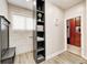 Bright bathroom area showcasing a storage shelf with towels, leading to a closet and walk-in shower at 7653 Carriage House Way, Zionsville, IN 46077