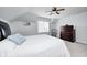 Comfortable bedroom features carpeted floors, ceiling fan, natural light and neutral wall paint at 7653 Carriage House Way, Zionsville, IN 46077