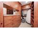 Spacious walk-in closet with custom wood drawers, shelving, and ample storage space for clothes at 7653 Carriage House Way, Zionsville, IN 46077