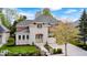 Charming brick and stone home with three car garage, well-maintained landscaping, and inviting entrance at 7653 Carriage House Way, Zionsville, IN 46077