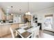 Kitchen featuring an eat in nook with white chairs at 7653 Carriage House Way, Zionsville, IN 46077