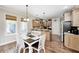 Kitchen eat in nook with butcher block table and stainless steel appliances at 7653 Carriage House Way, Zionsville, IN 46077