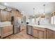 Kitchen featuring stainless steel appliances and stone countertops at 7653 Carriage House Way, Zionsville, IN 46077
