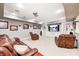 Spacious basement living room features a large entertainment center, recessed lighting, and comfortable seating at 7653 Carriage House Way, Zionsville, IN 46077