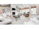 Cozy living room featuring a fireplace, built-in shelving, comfortable seating, and plenty of natural light at 7653 Carriage House Way, Zionsville, IN 46077