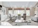 Bright living room with vaulted ceiling, fireplace, and comfortable seating at 7653 Carriage House Way, Zionsville, IN 46077