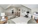Cozy loft area featuring an overlook, built-in shelves, and a dedicated workspace with modern amenities at 7653 Carriage House Way, Zionsville, IN 46077