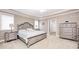Bedroom featuring tray ceilings and neutral paint at 7653 Carriage House Way, Zionsville, IN 46077
