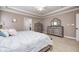 Bedroom with neutral paint and a tray ceiling at 7653 Carriage House Way, Zionsville, IN 46077