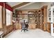 Office featuring custom wooden built-ins, creating an organized and functional workspace with natural light at 7653 Carriage House Way, Zionsville, IN 46077