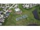 Aerial view showcasing community amenities including a pool, playground, tennis courts, and basketball courts at 7824 Gray Eagle Dr, Zionsville, IN 46077