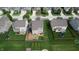 Aerial shot of a private backyard, including a patio, trampoline, and green space at 7824 Gray Eagle Dr, Zionsville, IN 46077