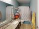 Bathroom featuring a vanity with a granite countertop and a shower with a curtain at 7824 Gray Eagle Dr, Zionsville, IN 46077