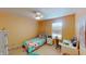 Cozy bedroom featuring bright natural light, cheerful decorations, and a ceiling fan at 7824 Gray Eagle Dr, Zionsville, IN 46077
