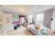 Charming bedroom with a chandelier, personal desk, and playful decor at 7824 Gray Eagle Dr, Zionsville, IN 46077