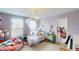 Cozy bedroom with soft lighting, creative decor, and comfortable furnishings at 7824 Gray Eagle Dr, Zionsville, IN 46077