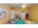 Another view of bedroom includes a bean bag chair, rug, and a whimsical Strawberry Shortcake print at 7824 Gray Eagle Dr, Zionsville, IN 46077