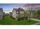 Beautiful two-story home with neutral siding, a front porch, a well-maintained lawn, and mature trees at 7824 Gray Eagle Dr, Zionsville, IN 46077