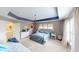 Bright and airy main bedroom with a tray ceiling, chandelier, and ample natural light at 7824 Gray Eagle Dr, Zionsville, IN 46077