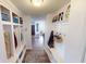 Functional mud room with built-in storage, hooks, and a patterned rug at 7824 Gray Eagle Dr, Zionsville, IN 46077
