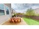 Outdoor patio area with a rustic table and chairs, perfect for dining and entertaining at 7824 Gray Eagle Dr, Zionsville, IN 46077