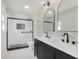 Modern bathroom with double vanity, unique mirrors, and glass-enclosed walk-in shower at 7950 Westfield Blvd, Indianapolis, IN 46240