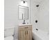 Newly remodeled bathroom featuring modern vanity, decorative wall paper, and stylish shower and tub combo at 7950 Westfield Blvd, Indianapolis, IN 46240