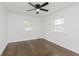Bedroom featuring hardwood floors, a ceiling fan and two windows at 7950 Westfield Blvd, Indianapolis, IN 46240