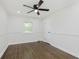 Bedroom features hardwood floors, large window and white trim at 7950 Westfield Blvd, Indianapolis, IN 46240