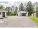 Detached two car garage with basketball hoop and long driveway in rear of house at 7950 Westfield Blvd, Indianapolis, IN 46240
