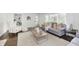Bright living room featuring contemporary decor, large windows, hardwood floors and stylish furniture at 7950 Westfield Blvd, Indianapolis, IN 46240