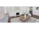 Comfortable living room with fireplace, modern decor, hardwood floors, and lots of natural light at 7950 Westfield Blvd, Indianapolis, IN 46240