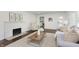 Comfortable living room with fireplace, modern decor, hardwood floors, and lots of natural light at 7950 Westfield Blvd, Indianapolis, IN 46240