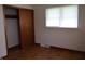 Bedroom features hardwood floors, a closet with sliding doors, and a window at 8341 N Washington St, Sheridan, IN 46069