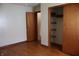 Bedroom with hardwood floors and a closet with sliding doors at 8341 N Washington St, Sheridan, IN 46069