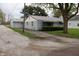 Charming single-story home with light blue siding and a detached garage at 8341 N Washington St, Sheridan, IN 46069