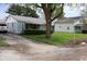 Single-story home featuring light blue siding with mature trees at 8341 N Washington St, Sheridan, IN 46069