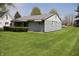 Well-maintained single-story home with light blue siding and a spacious yard at 8341 N Washington St, Sheridan, IN 46069