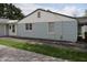 Home's exterior features light blue siding, white trim, and a gravel driveway at 8341 N Washington St, Sheridan, IN 46069